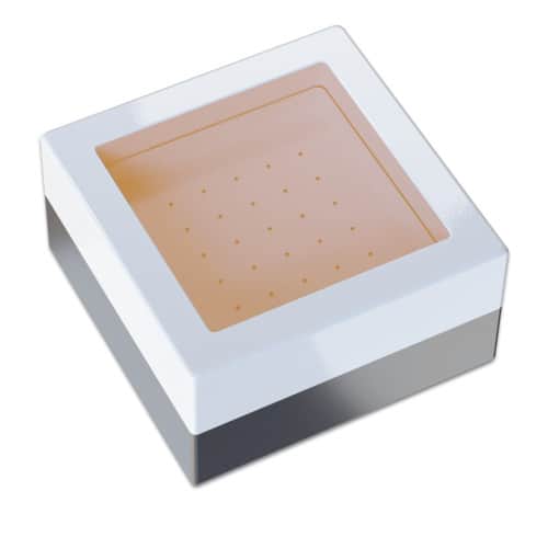 Amber LED light bulb with a round shape, emitting warm light, set against a white background.