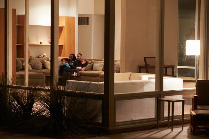 A bright, sunlit room with plants, illustrating the concept of human-centric lighting and its benefits for well-being.