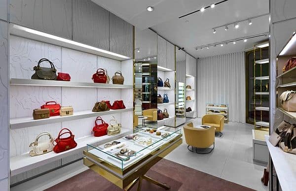 Retail space illuminated with LUXEON Fusion lighting, showcasing vibrant product displays and an inviting atmosphere.