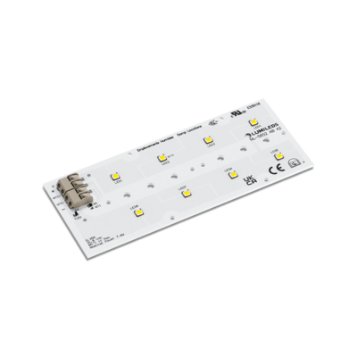A close-up of a Lumileds LED light engine, showcasing its sleek design and multiple optical components from an angled view.